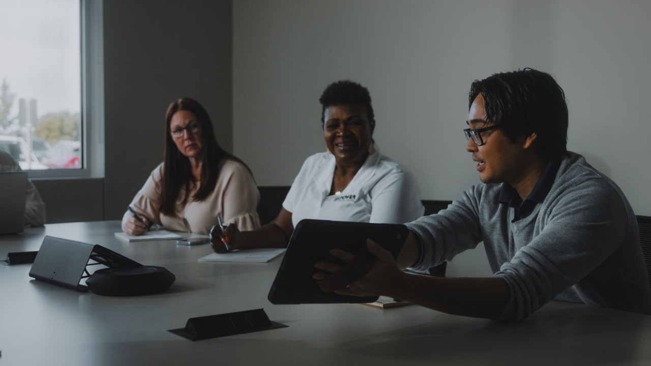 plumbing company employees discussing marketing